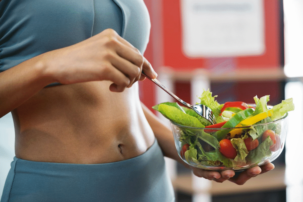 Woman holding a fresh vegetable salad to promote healthy eating and weight loss